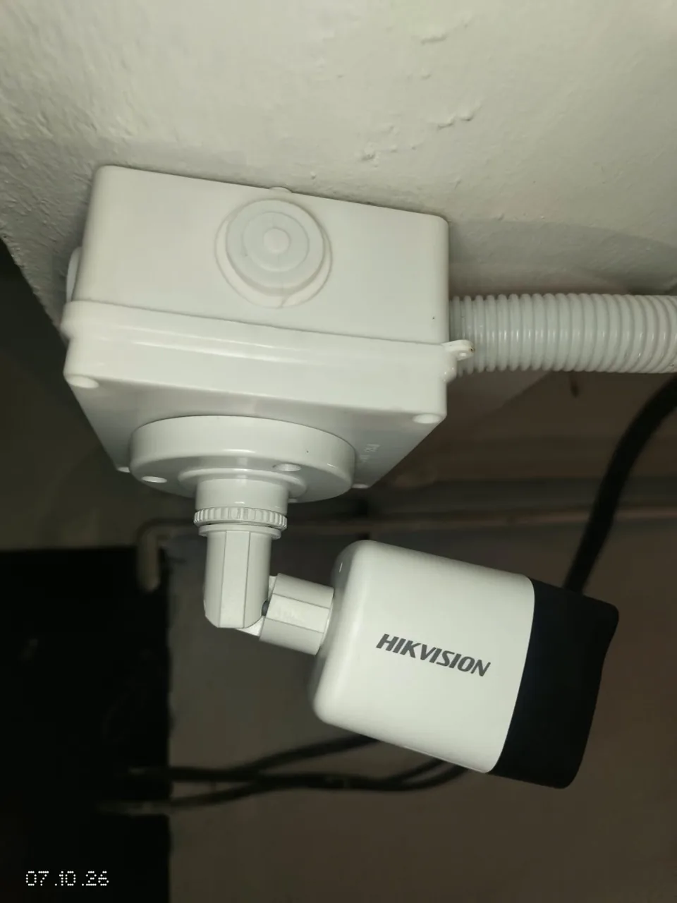 Hikvision bullet camera with a junction box and corrugated conduit